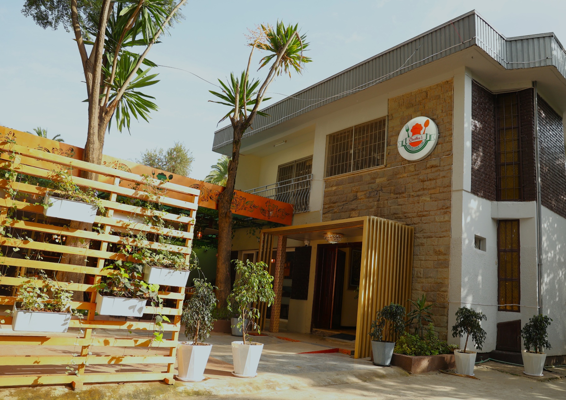 Radha's restaurant entrance with golden façade